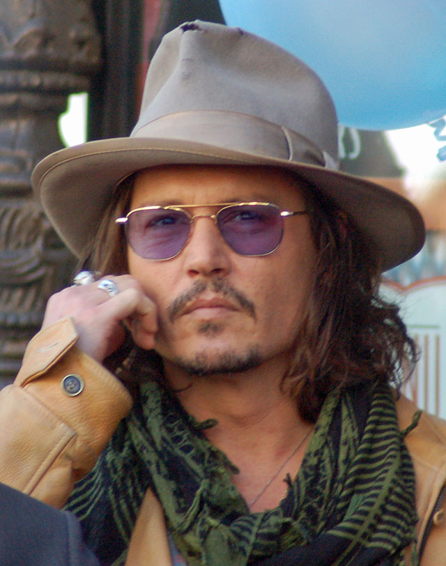 Depp at Penélope Cruz's ceremony to receive a star on the Hollywood Walk of Fame in April 2011