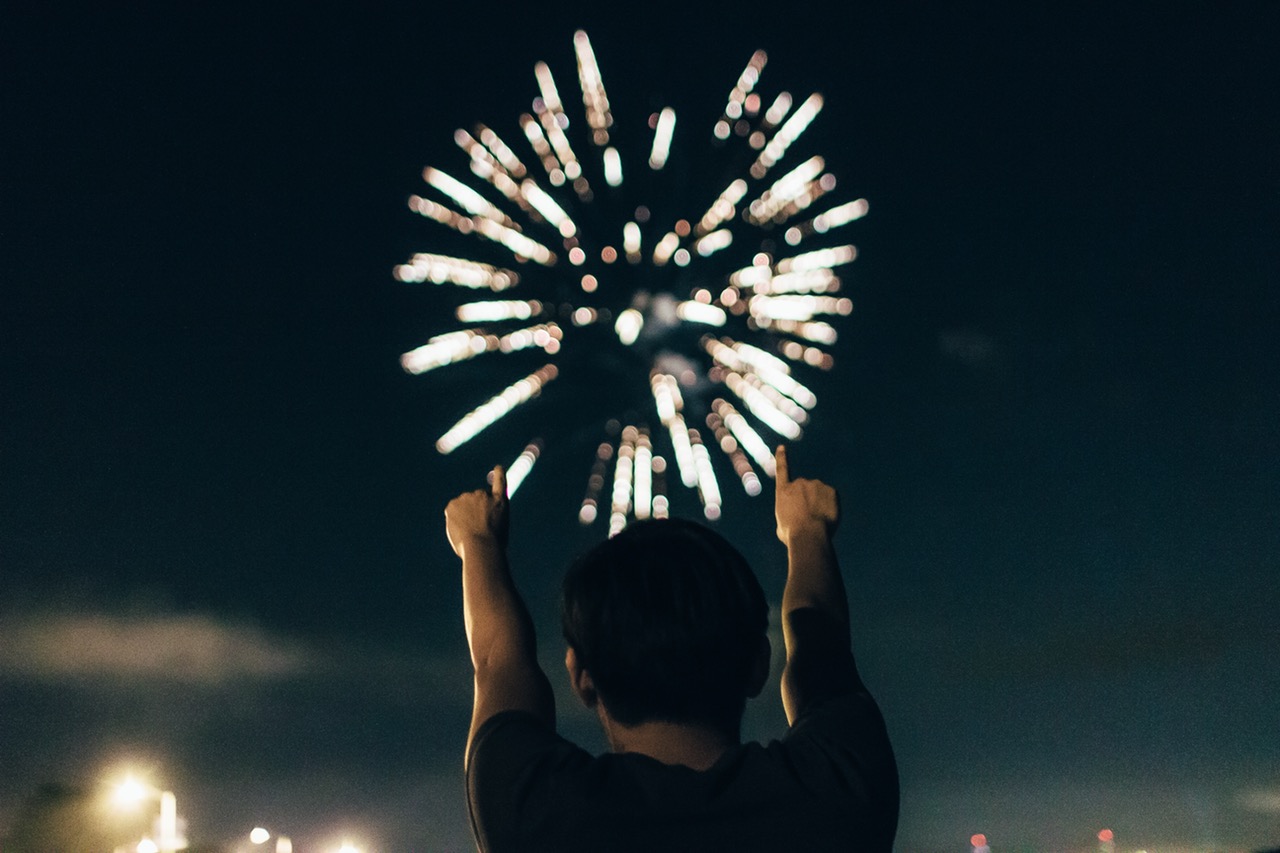 man marks the new year in with fireworks. 